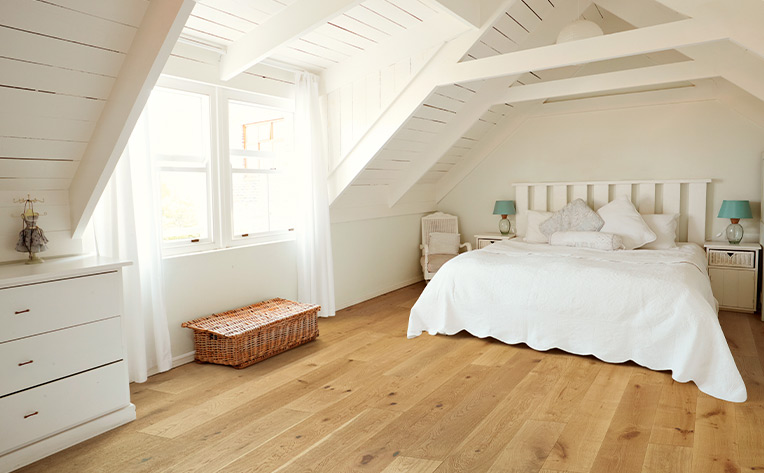 hardwood flooring in spacious upstairs bedroom