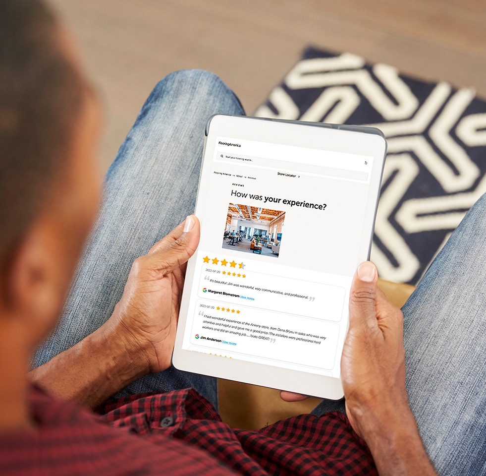 Person looking at flooring store reviews on tablet